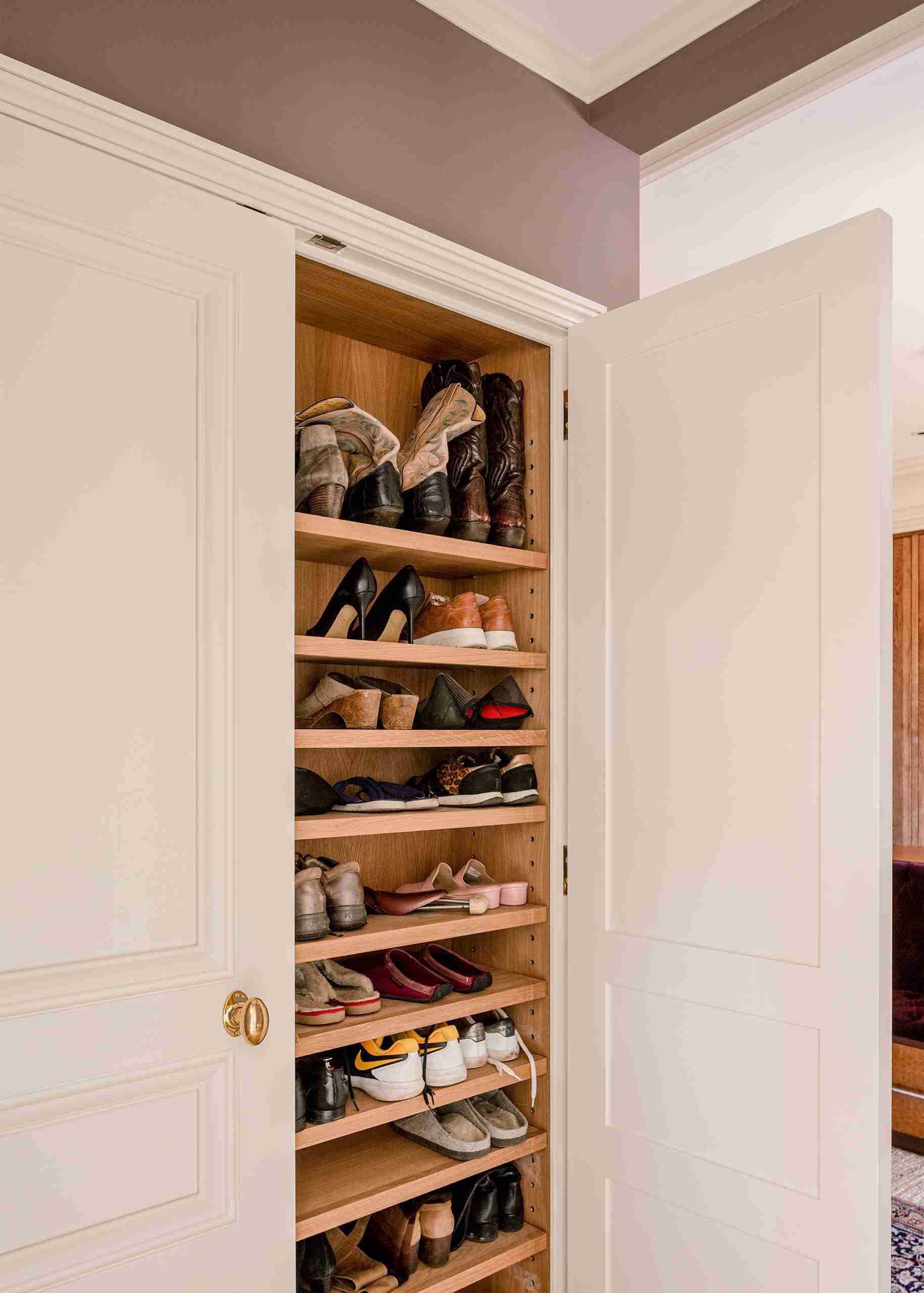 Grey cabinetry custom made shoe storage wardrobe.