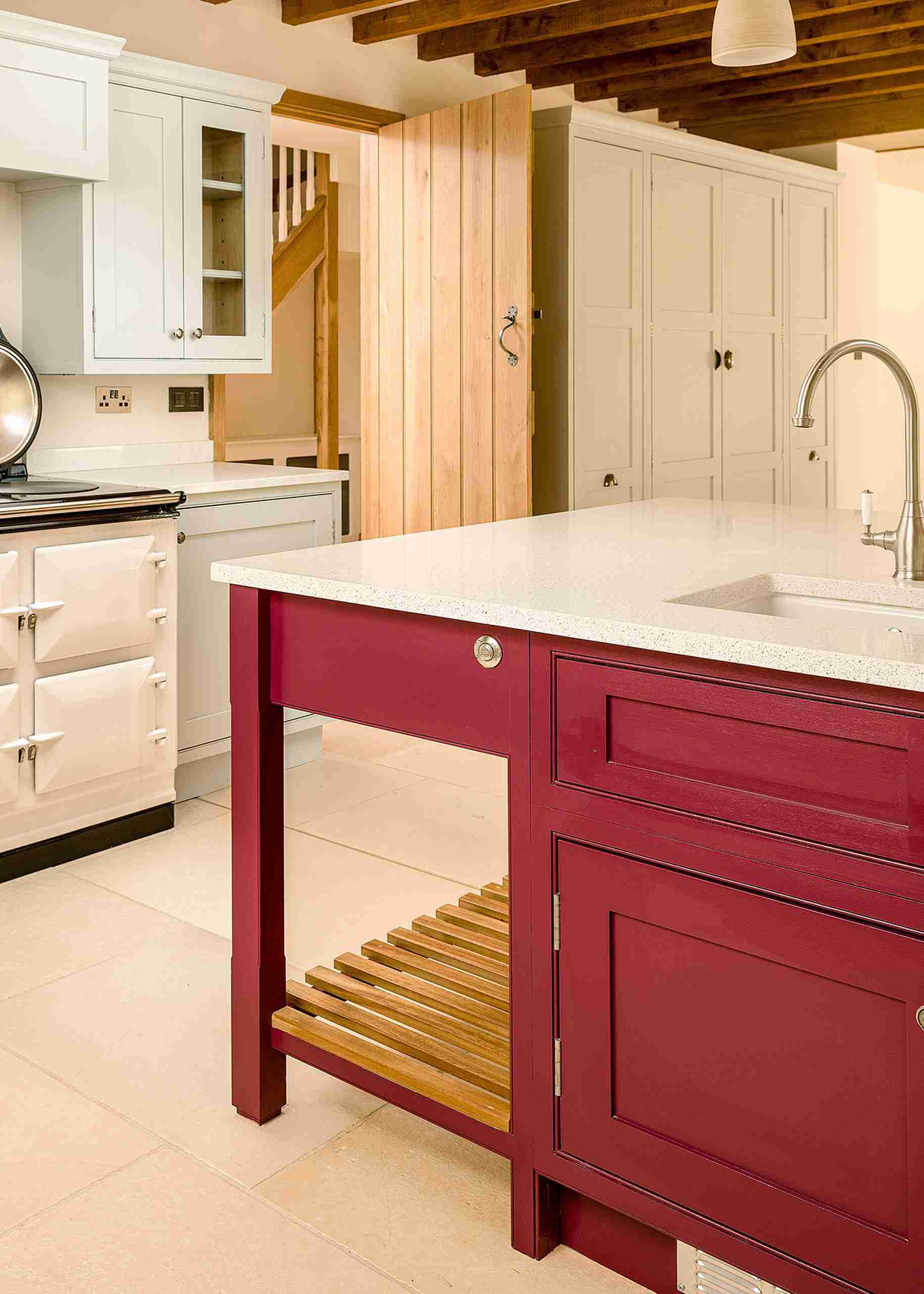 Striking bespoke luxury kitchen featuring hand made island.