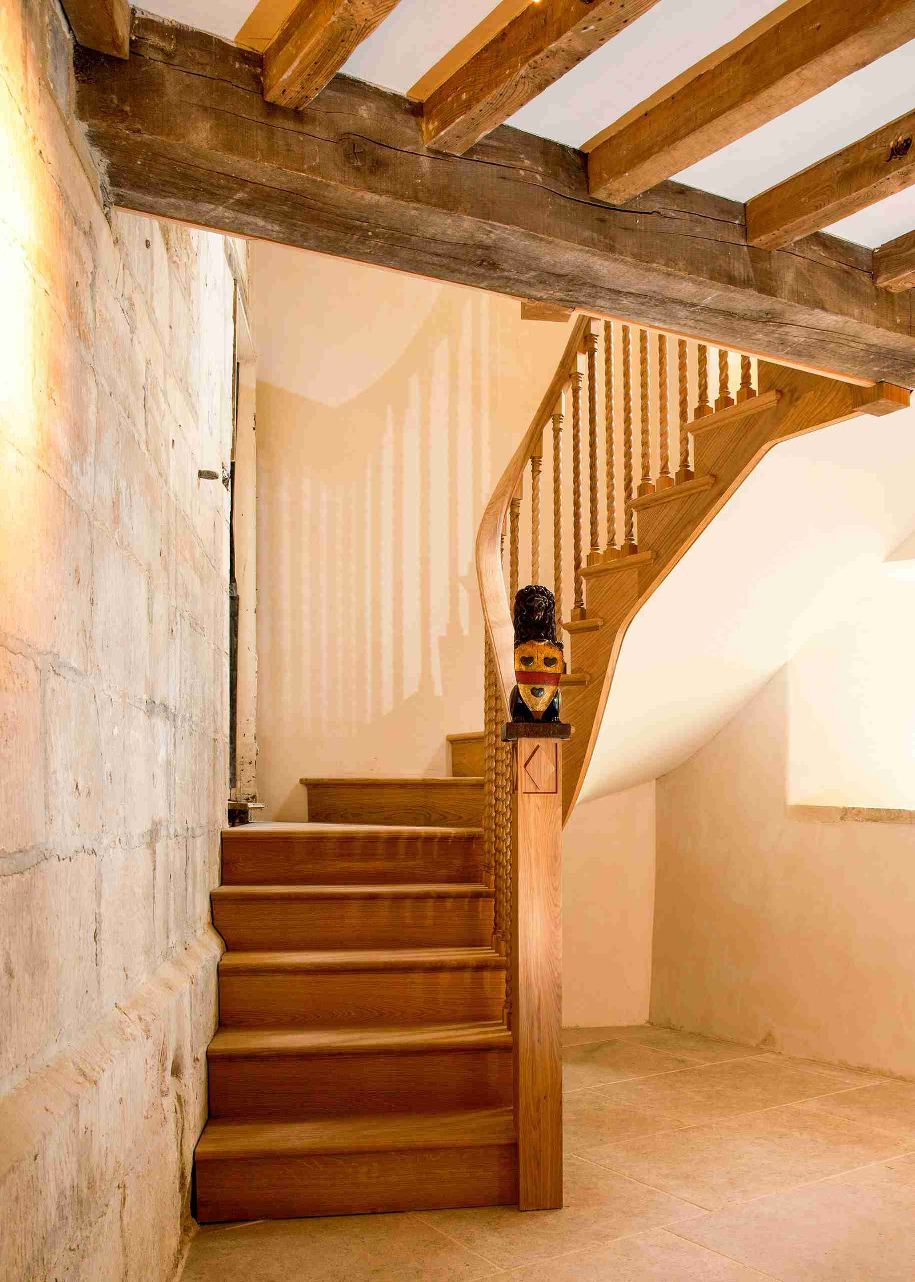 Traditional oak staircase with turned spindles and feature newel post — crafted by master joiners in Oxfordshire.