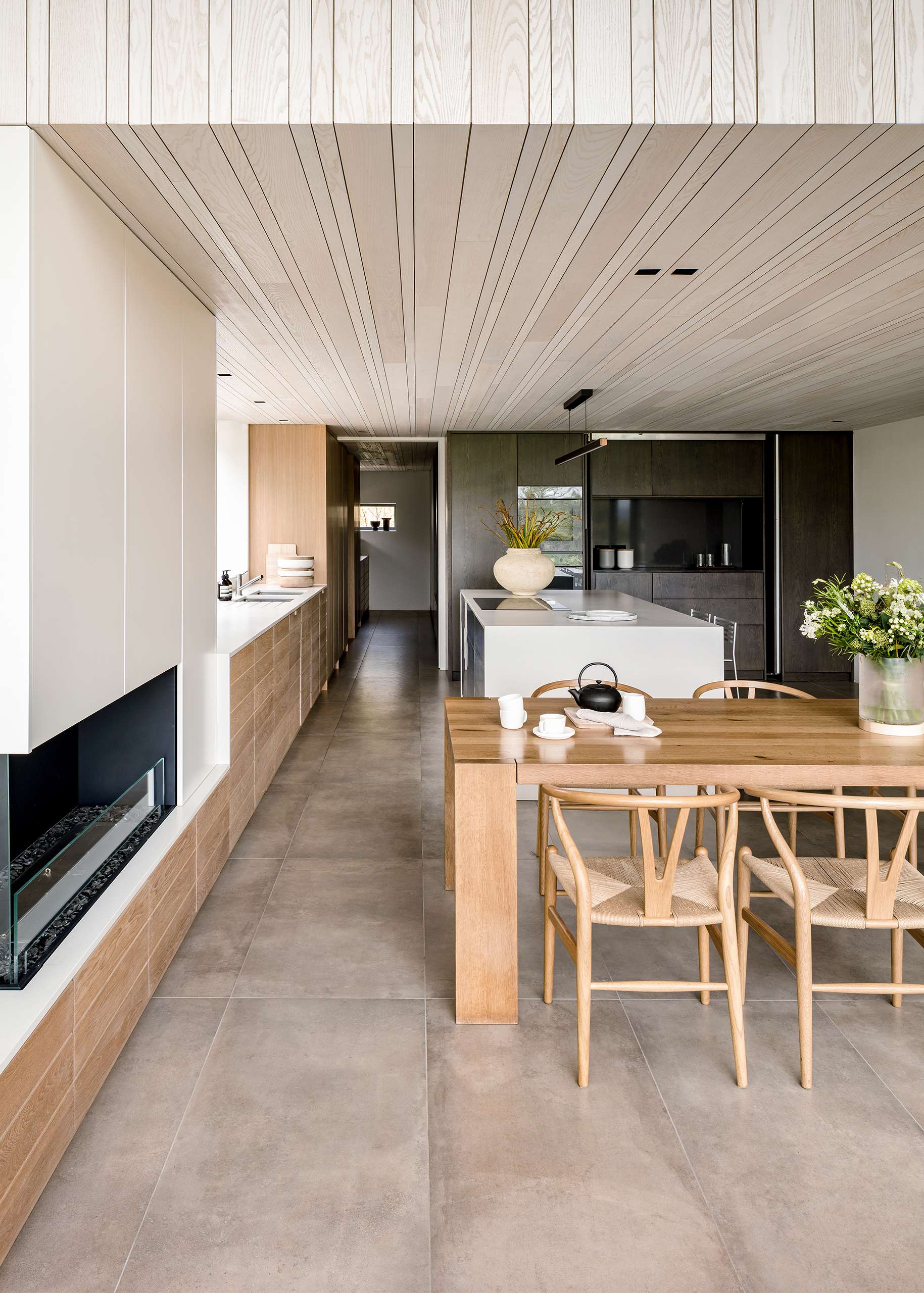 Bespoke Kitchen custom joinery with wooden panelling and modern minimalist finish.