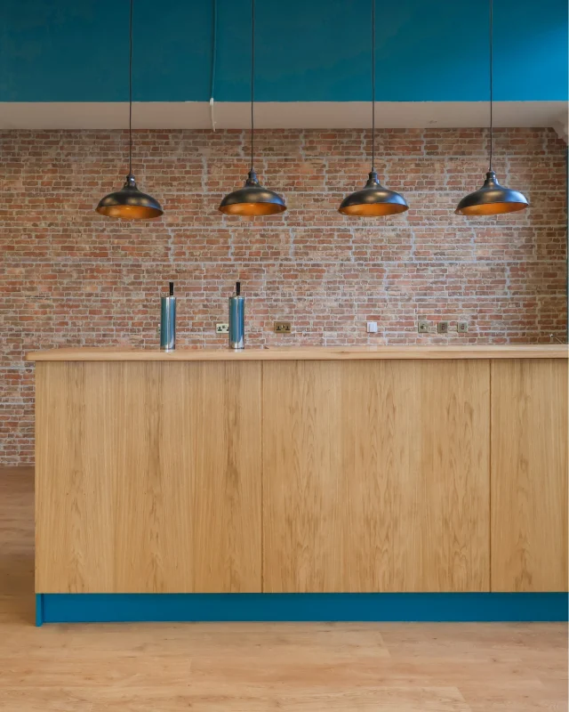 We are excited to share our latest installation for @noughtsandnibbles, a new games café coming to Bicester Town Centre.Working closely with the client, we designed, manufactured and installed two bespoke servery counters for this fantastic venue, set within a beautifully converted former bank.The carcasses were crafted from oak veneered MDF with solid oak lipping’s. Shaker style doors add a classic touch and were made from tulipwood with MDF centres, as were the drawers and end panels. All were spray finished in a stunning teal shade, fitting with the vibrant space.The solid oak worktops were finished with two coats of Clear PU lacquer, providing a durable and hard-wearing finish ready for busy café life.We love seeing projects like this come together and wish Noughts and Nibbles every success with their opening!