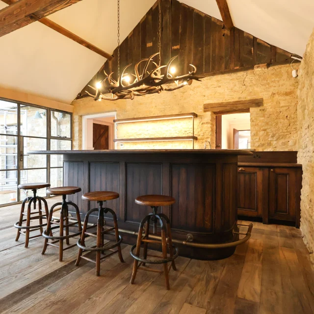 We’re delighted to share a recently completed bespoke design and fit project for a private client.The scope of works included a bespoke bar and back bar, internal door sets made from reclaimed oak flooring boards, wall panelling, a bi-fold door set, and custom window boards throughout. The standout feature is the striking bar area. To achieve its characterful, rustic finish, the bar was expertly French polished using a distressed technique, giving it a beautifully aged appearance that complements the space perfectly.We’re thrilled with how this bespoke project came together.